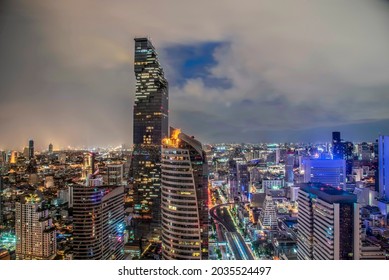 Bangkok Night Life With Illuminated Cityscape On Skyscraper