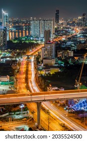 Bangkok Night Life With Illuminated Cityscape On Skyscraper