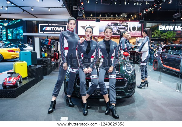 BANGKOK - November 28, 2018 :
Unidentified model with Mini car on display at The Bangkok
International Motor Expo 2018 on November 28, 2018 in Bangkok,
Thailand.