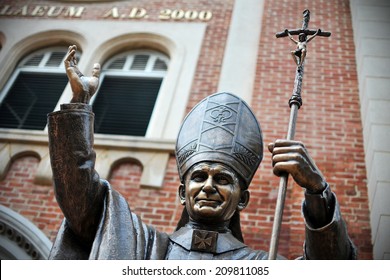 BANGKOK - OCT 17: View of a statue of Pope Saint John Paul II at Assumption Cathedral on Oct 17, 2011 in Bangkok, Thailand. Pope John Paul II visited the cathedral during his trip to Thailand in 1984.