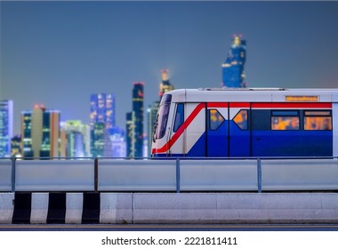 Bangkok SkyTrain stops on train tracks with blurred city background on night scene and copy space, Sky Train is a mass transit system in Bangkok to assist facilitate and  fast journey