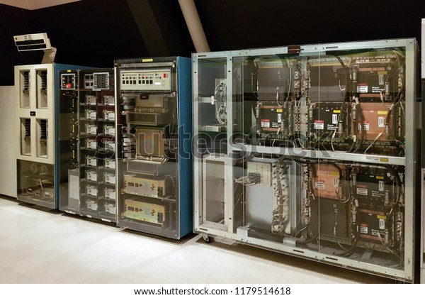 Bangkok, TH -\
AUGUST 28, 2018: The old dusty vintage mainframe computer towers\
with many tapes, cables and electrical mainboards, showing in the\
Information Technology\
Museum.