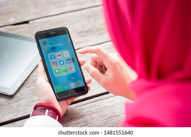 BANGKOK, THAILAND- 10th August 2019 : Hands Of Islamic Woman Use Iphone With Social Media Application Of Facebook, Youtube, Google Search, Instagram, Twitter, Linked In, Line Whatsapp, And Pinterest