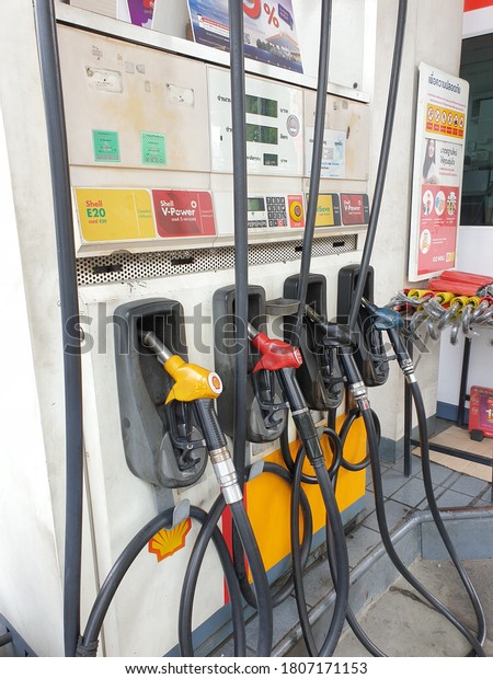 BANGKOK, THAILAND - 11 AUGUST 2020 : Refueling cabinet\
has a multi-color filling head divided into yellow heads into E20.\
Red head is Gasohol95 V-power Black head is feelsave and blue head\
is Diesel V