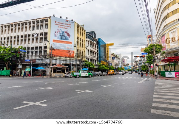 BANGKOK, THAILAND - 1.11.2019: Streets in the\
China town, Bangkok city. Traffic on street with the market on\
side. Heavy transportation, cars and motorbikes. Famous tourist\
destination in\
Bangkok.