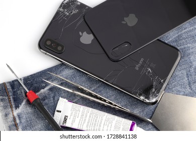 Bangkok, Thailand, 12 May 2020. Pictures of iphone x smartphone. Close the rear window and the repair concept and repair equipment on a white background and copy the space for the text.