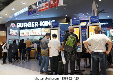 BANGKOK, THAILAND - 13 DEC 2019: People Using Self-ordering Kiosk At Burger King Store. Burger King Serve More Than 11 Million Guests Per Day In 91 Countries And Territories Around The World.