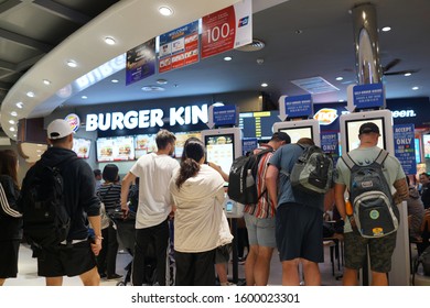 BANGKOK, THAILAND - 13 DEC 2019: People Using Self-ordering Kiosk At Burger King Store. Burger King Serve More Than 11 Million Guests Per Day In 91 Countries And Territories Around The World.