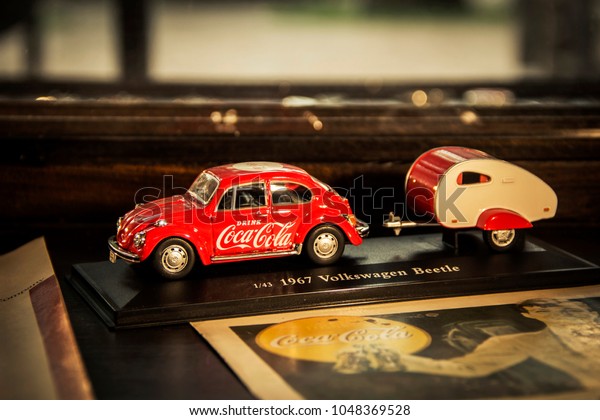 BANGKOK, THAILAND - 13 Mar 2018 : Model Toy\
Volkswagen car red and beetle or bug trailer with Logo sign\
Coca-Cola at Coke beverage museum Ban Bang\
Khen.