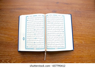 Bangkok, Thailand, 17 May 2016 : Reading the Holy Quran (Islamic Book) on Wooden table