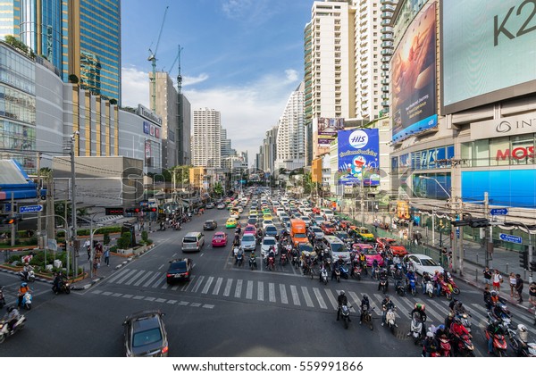 BANGKOK, THAILAND 18-JAN_2017: Traffic jam\
late afternoon of Asoke intersection where Sukhumvit Rd. cuts\
Ratchadaphisek Rd. during rush\
hours\
\
