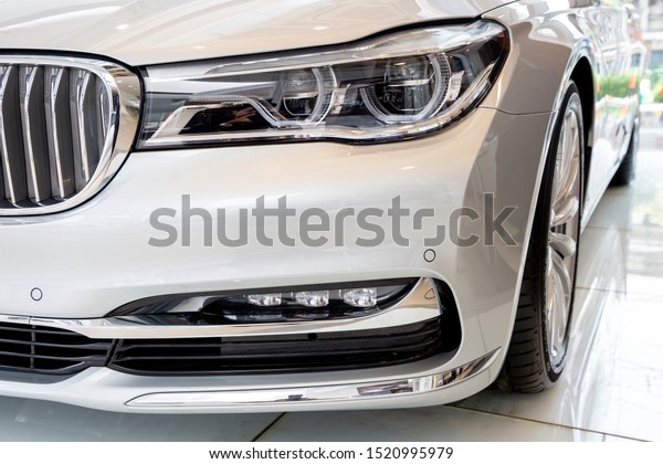 Bangkok , Thailand 2019 : close up headlight front view\
of BMW 730 LD Pure Excellence luxury car presented in motor show\
Thailand .