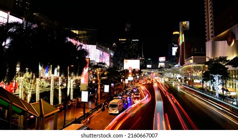 BANGKOK, THAILAND - 22 DEC : Night traffic with long exposure at Rajdamri road on 22 December 2019 in Bangkok, Thailand