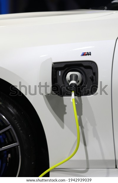 Bangkok, Thailand 23March 2021:The electric car is being\
charged at a special place for charging electric vehicles. A modern\
and eco-friendly mode of transport that has become widespread at\
Asia.  