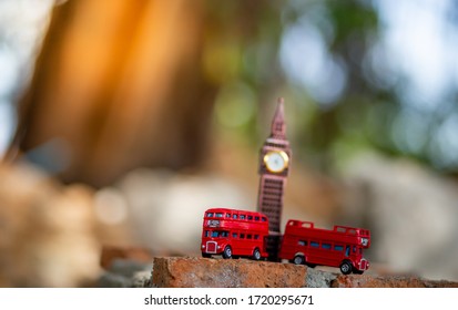 Bangkok, Thailand - 24 April 2020:Toys that represent two of the main symbols of the city of London, red bus and The London famous Big Ben model on blurred background. decoration​ image​ contain​ cert