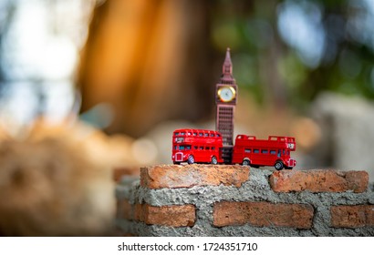 Bangkok, Thailand - 24 April 2020:Toys that represent two of the main symbols of the city of London, red bus and The London famous Big Ben model on blurred background. decoration​ image​ contain​ cert