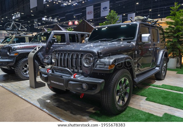 Bangkok, Thailand -\
24 March 2021 : New Jeep 4x4 Off Road Sport Utility Car with\
beautiful exhibition design boot show on display in 42th Bangkok\
International Motor Show\
2021