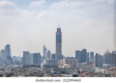 Bangkok, Thailand - 2nd January 2022: Baiyoke Sky Hotel Tower Surrounding by Urban City Skyscraper Buildings on a Sunny Day.