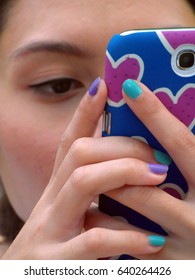 Bangkok, Thailand - 30th December, 2012: A Teenage Thai Girl Focuses On Using Her Smartphone. Thailand Has The Second Highest Usage Of Smartphones In South-East Asia.