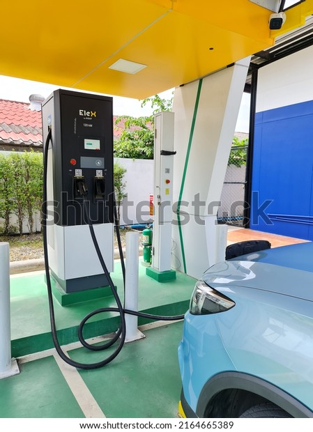 Bangkok, Thailand 5 June 2022:\
Power Supply Connects to Electric Vehicles to Charge Batteries,\
Industry Transport, New Charging Technology, the Future of\
Automotive.