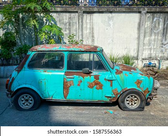 Bangkok Thailand - 9 Dec 2019: Old And Rusty Mini Cooper Car On The Street Waiting For Repair