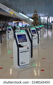 BANGKOK, THAILAND - Apr 2022:  Self Check-in or Self service machine and help desk kiosk at airport for check in, printing boarding pass or buying ticket.