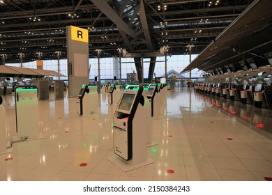 BANGKOK, THAILAND - Apr 2022:  Self Check-in or Self service machine and help desk kiosk at airport for check in, printing boarding pass or buying ticket.