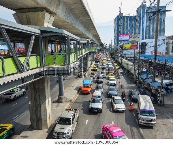 Bangkok, Thailand - Apr 22, 2017.\
Cars run on street in Bangkok, Thailand. Bangkok is the capital of\
Thailand with a population of over 7 million\
inhabitants.