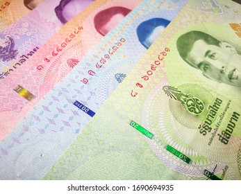 Bangkok, Thailand - April 01 2020: Various of Thai bank notes. Thai people use Thai baht to exchange for goods and services.