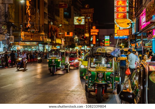 Bangkok, Thailand - April 10,2017; Famous\
moto-taxi called tuk-tuk is a landmark of the city and popular\
transport, Tuk tuk on the street in Chinatown, street food night\
market in bangkok\
thailand.