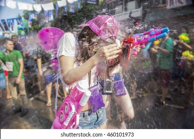Bangkok, Thailand - April 13 : Let's play with splash of water gun each other in Songkran Festival at Khaosan Road on April 13, 2016 