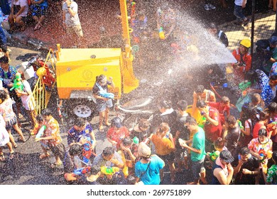 BANGKOK, THAILAND - APRIL 14, 2015: people playing water in Songkran festival on April 14, 2015 at Silom Road in Bangkok.