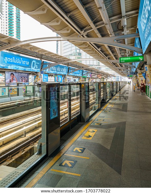Bangkok, Thailand (April 14,\
2020): Bangkok\'s normally packed Asok BTS Skytrain station is empty\
on Songkran, traditionally one of the busiest days of the\
year.