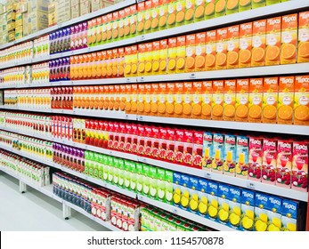 Bangkok, Thailand - April 20, 2018: Various Fruit Juice Bottles In Shelf Supermarket. Orange Juice And Mixed Fruit Juice With Cranberry On Shelves In Supermarket.