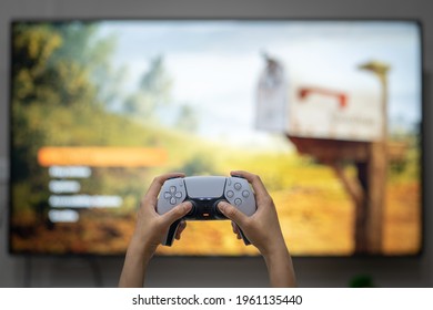 Bangkok, Thailand - April 2021 : Hand On People Is Holding Play Station 5 Controller With Blurred Background Of 