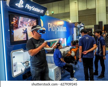 BANGKOK, THAILAND - APRIL 23, 2017: Newest Virtual Reality Games By PlayStation 4. Young Man With Pleasure Uses VR Head-mounted Displays At Thailand Comic Con 2017 In ROYAL PARAGON HALL, 