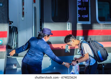 Bangkok, Thailand - April 23, 2017: Uniformed Train Hostess Is Welcoming And Serving Passengers In Hua Lamphong Railway Station For The Express Train From Bangkok To Chiang Mai Destination.