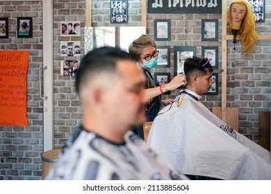 Bangkok, Thailand - April 25, 2017 : Unidentified asian man hairdresser or hairstyle haircut a man plump body customer in fashion hairstyle at barbershop
