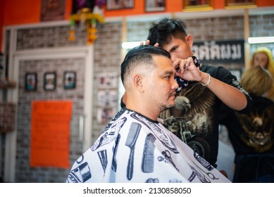 Bangkok, Thailand - April 25, 2017 : Unidentified Asian Man Hairdresser Or Hairstyle Haircut A Man Plump Body Customer In Fashion Hairstyle At Barbershop