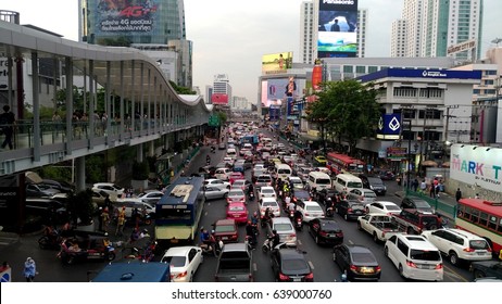BANGKOK, THAILAND - APRIL 28, 2017 : Taxis, buses, motorbikes and cars in Bangkok are in traffic jam during Friday evening.Traffic moves slowly along a busy main road in front of central world, Bangkok.
