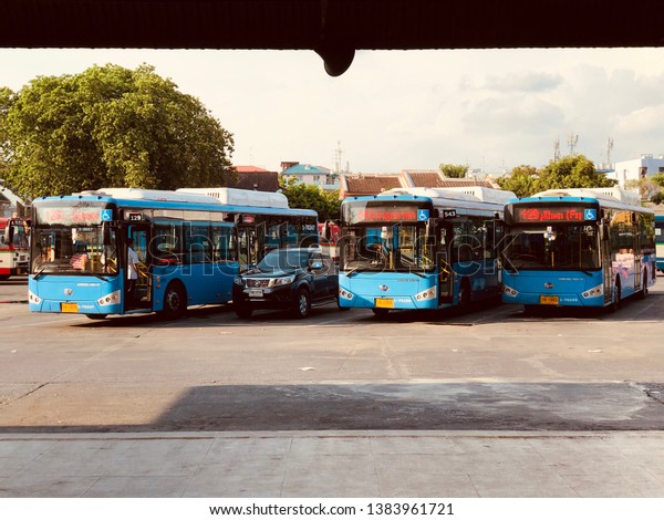 BANGKOK, THAILAND. APRIL 29,\
2019: the vibes around the bus lane of Bangkok city bus station at\
the late afternoon time which many buses are waiting for departure\
time.