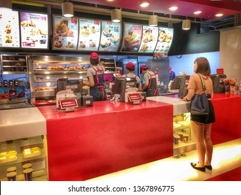 Bangkok, Thailand - April 7, 2019: Unidentified People Buying Fried Chicken At KFC Restaurant. Kentucky Fried Chicken Is A Fast Food Restaurant Chain That Specializes In Fried Chicken.