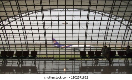 Bangkok, Thailand - April 9, 2010 - The large window display the image of the plane prepare to take off at Suvarnabhumi Airport.