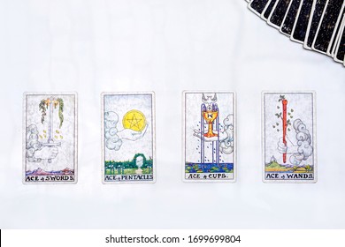 Bangkok, Thailand- April-3-2020:  Ace of sword , Ace of pentacle , Ace of cup , Ace of wand tarot cards with other cards on the back side. 