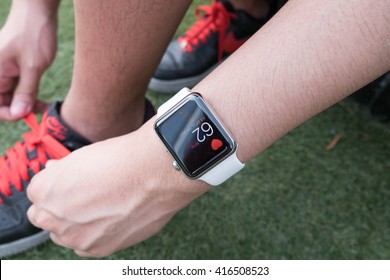 BANGKOK, THAILAND - Aug 16, 2015: Sport Man With Apple Watch Heart Rate Screen