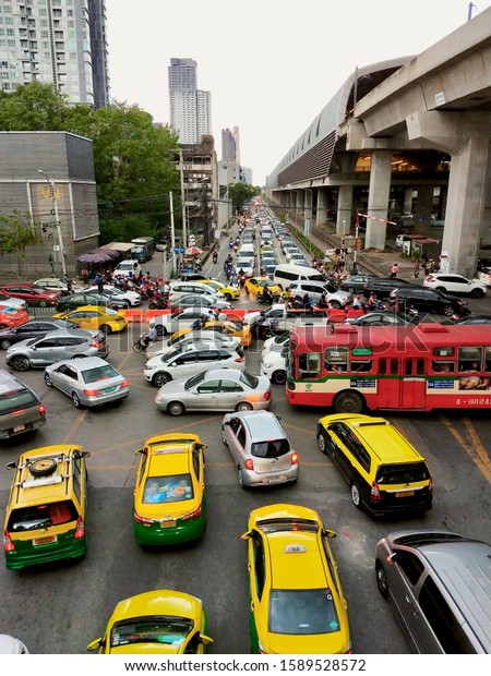 BANGKOK, THAILAND, AUG 16, 2019: Bangkok\
traffic jam in the rust hours with\
cityscape