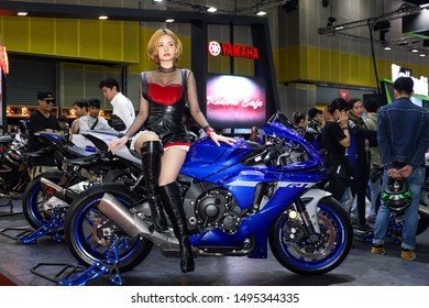 Bangkok, Thailand, Aug 24, 2019 - Pretty Asian model sitting on Yamaha R1 in Bangkok Big Motor Sale