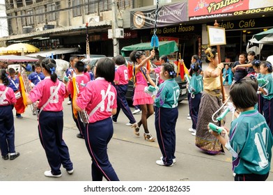 BANGKOK, THAILAND - August 1, 2012. Asahna Bucha Religious School Procession (commemorates Buddha's First Sermon On The Four Noble Truths). Children Carry Gifts For Buddhist Monks Who Begin Fasting.