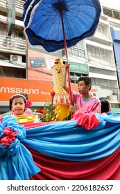 BANGKOK, THAILAND - August 1, 2012. Asahna Bucha Religious School Procession (commemorates Buddha's First Sermon On The Four Noble Truths). Children Carry Gifts For Buddhist Monks Who Begin Fasting.