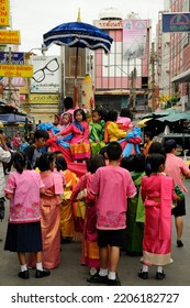 BANGKOK, THAILAND - August 1, 2012. Asahna Bucha Religious School Procession (commemorates Buddha's First Sermon On The Four Noble Truths). Children Carry Gifts For Buddhist Monks Who Begin Fasting.